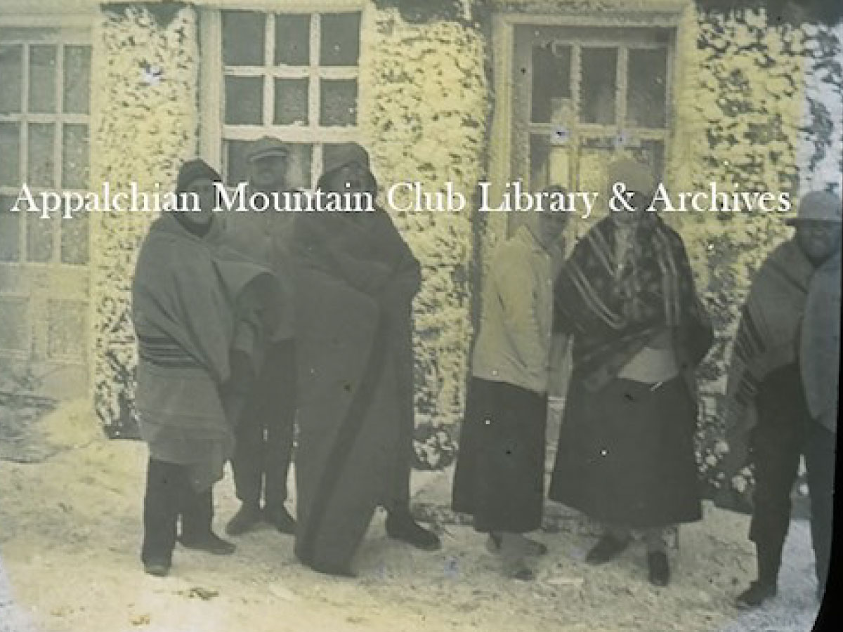 Group standing in front of Lakes of the Clouds Hut