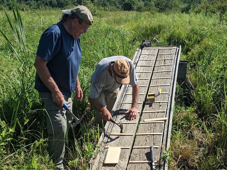 A.T. crew repairing a boardwalk
