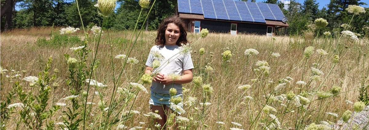 Child in a field of flowers