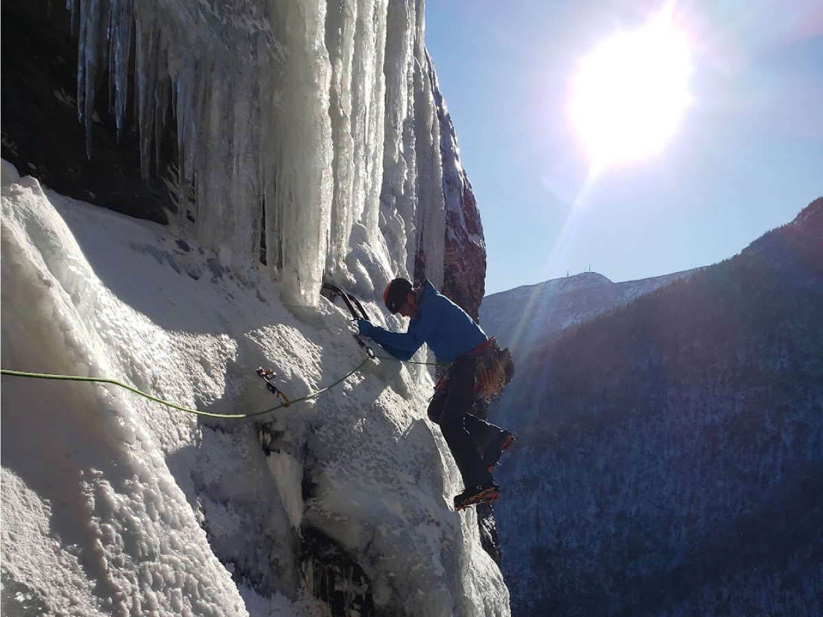 Climber on an ice cliff