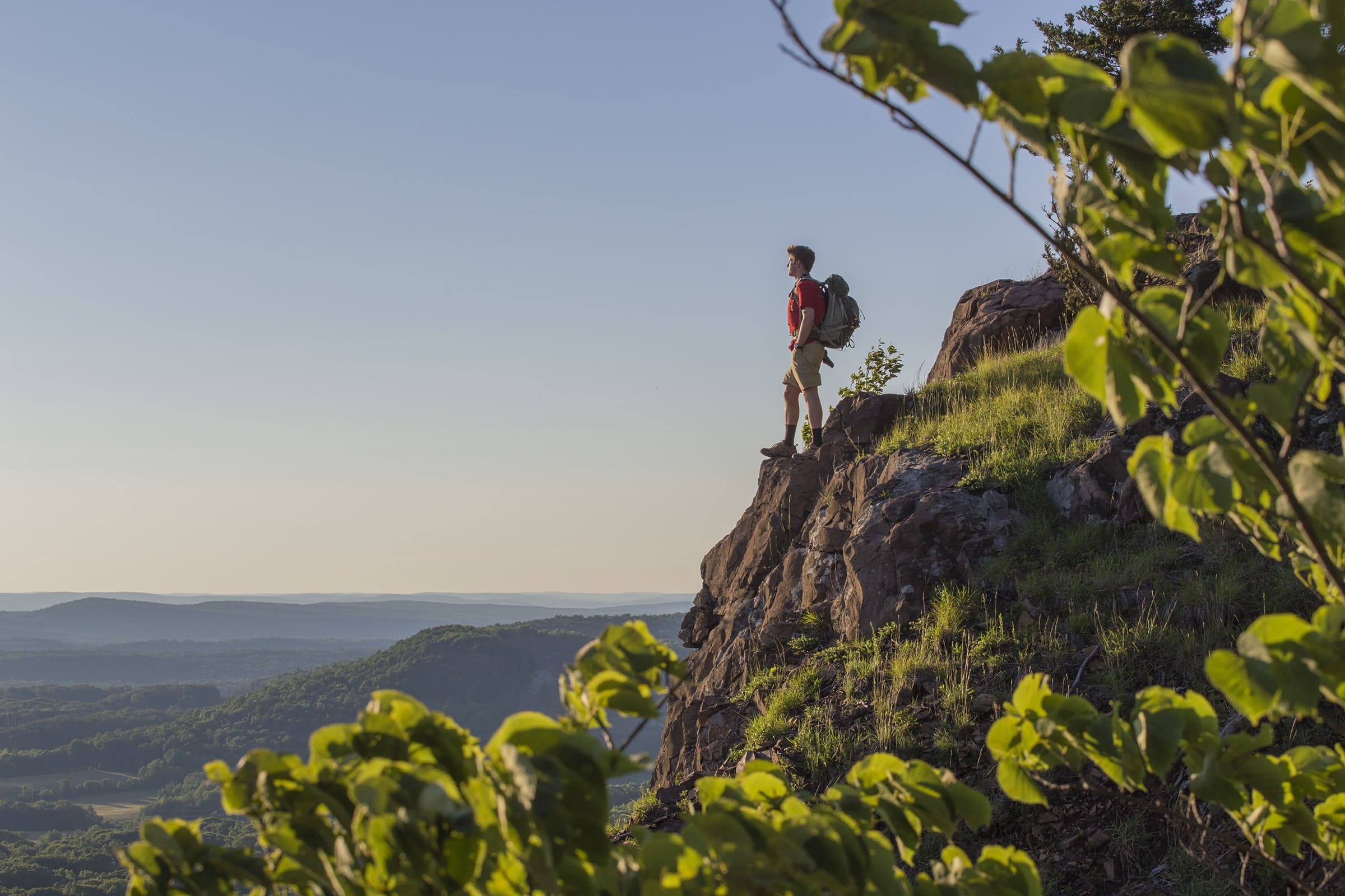 Hiker looking out over a cliff